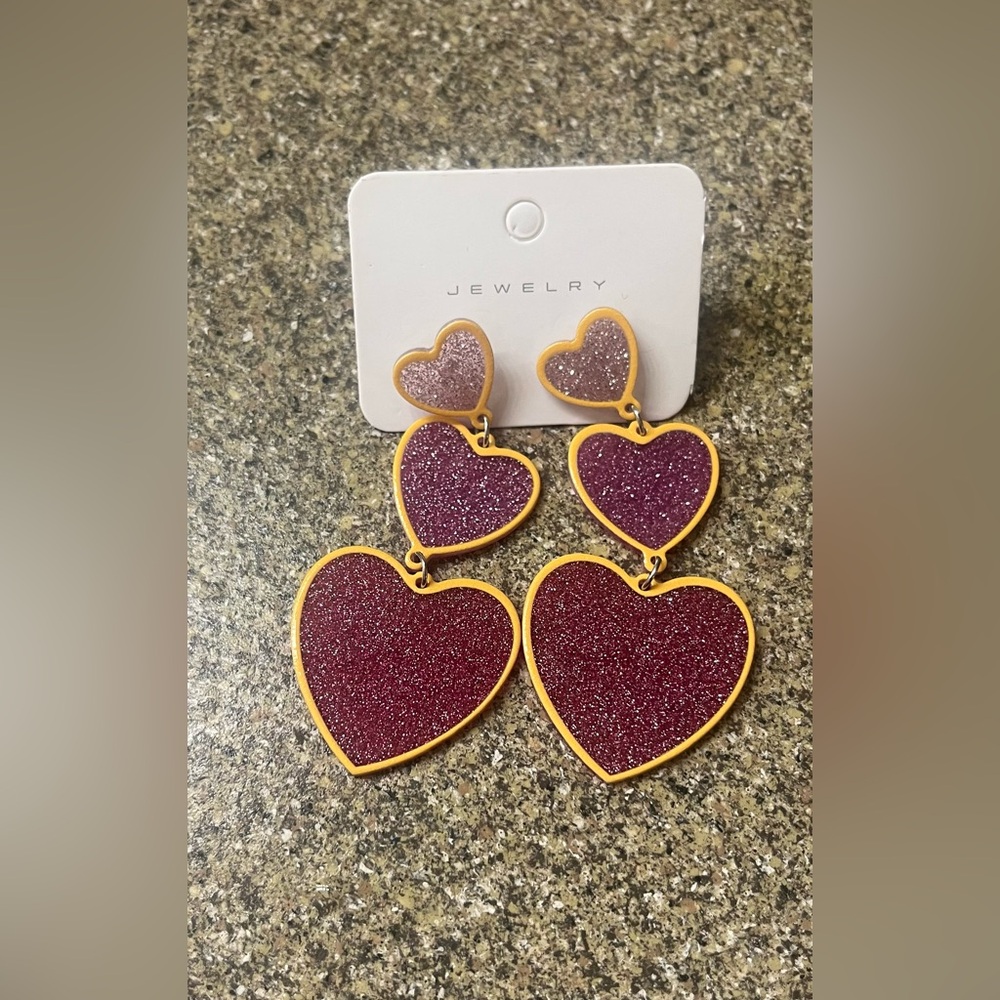Brand New dangling chain of Hearts plastic earrings still in package - Picture 1 of 1